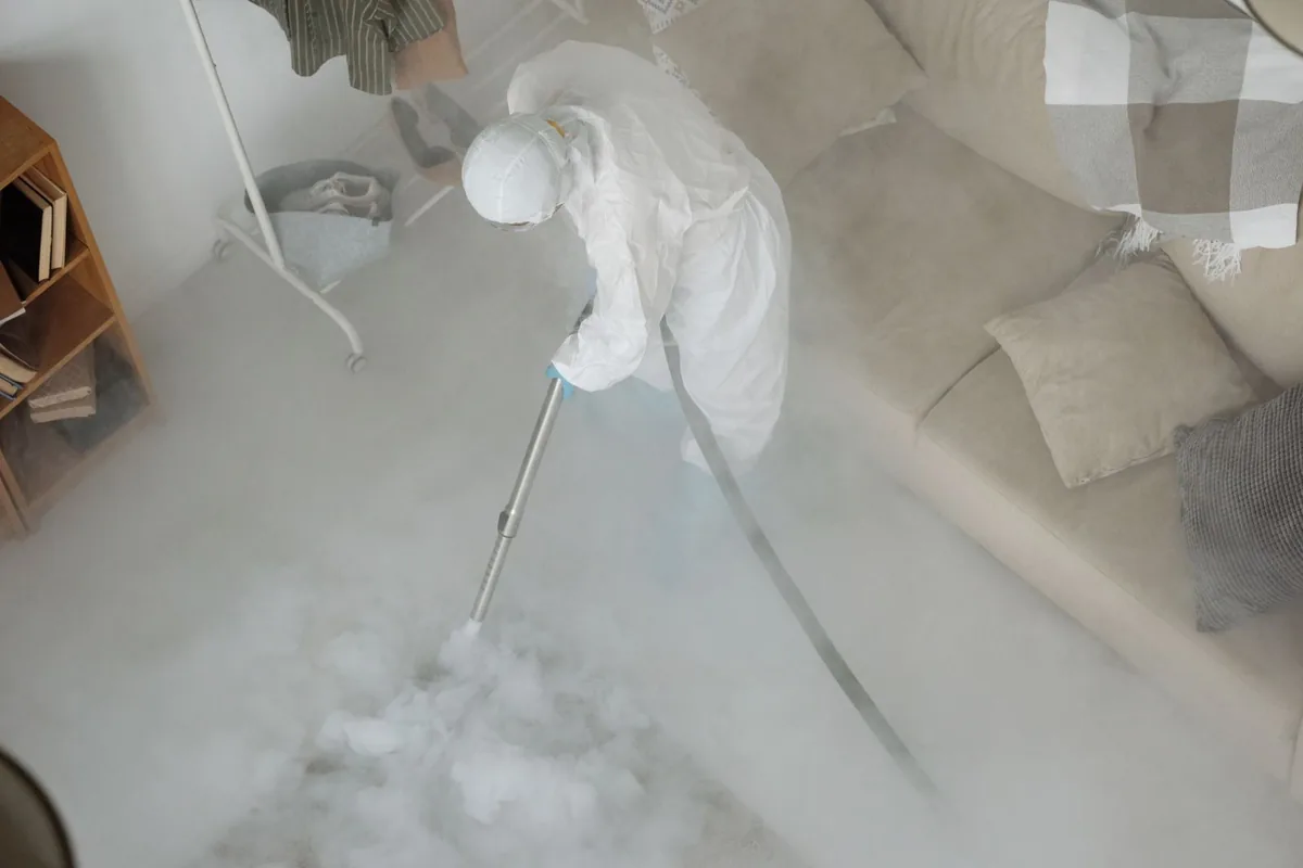 Biohazard cleanup technician in protective equipment, Waterloo, NY